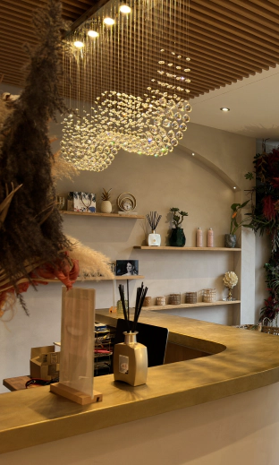 Dentozen reception with hanging plants and gold desk