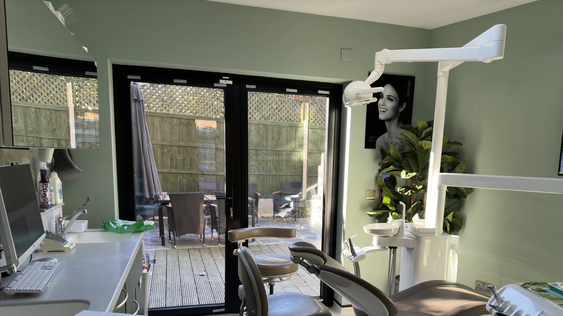 Inside Dentozen — crystal chandeliers, tropical plants, and warm lighting