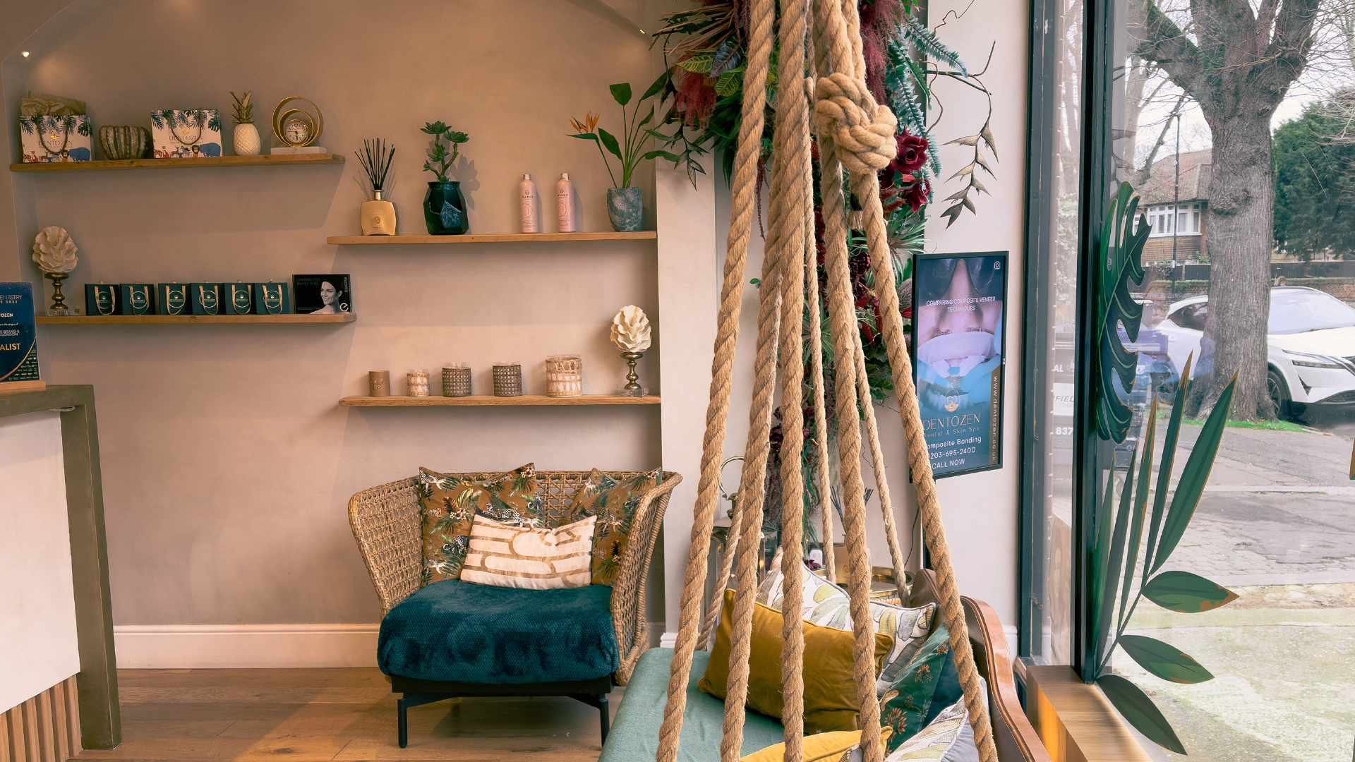 Dentozen reception — swing chairs, tropical plants, and crystal chandeliers